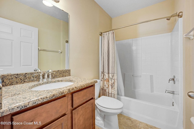 full bathroom featuring tile patterned flooring, vanity, toilet, and shower / bath combo with shower curtain