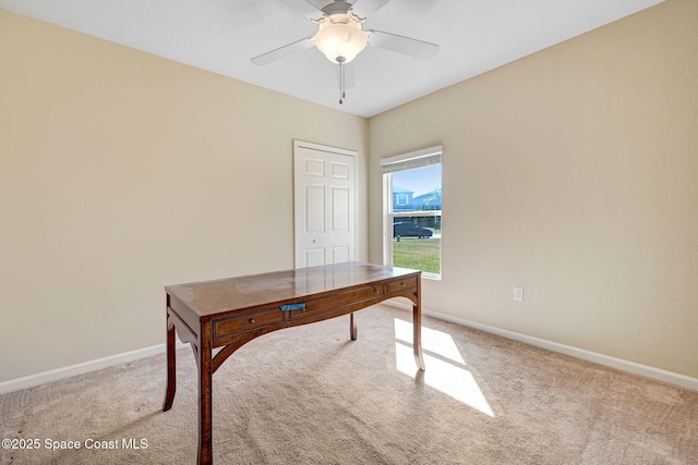 carpeted office with ceiling fan