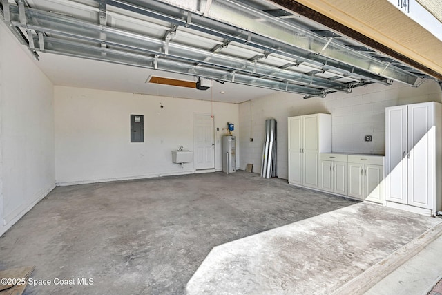 garage featuring sink, a garage door opener, electric panel, and electric water heater