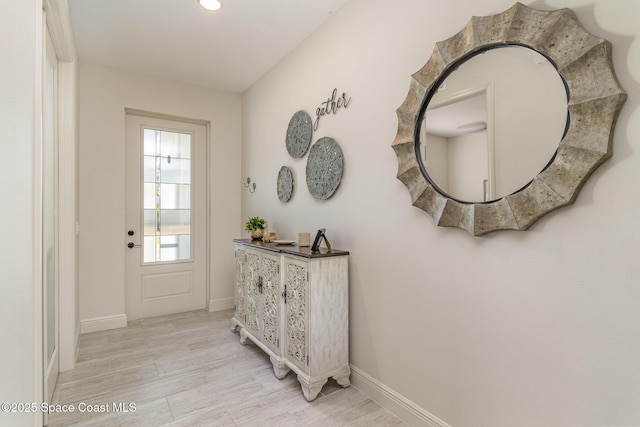 foyer entrance with light wood-type flooring