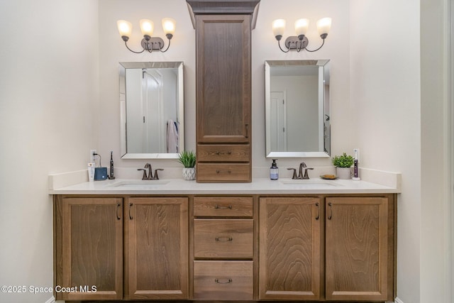 bathroom featuring vanity and a notable chandelier