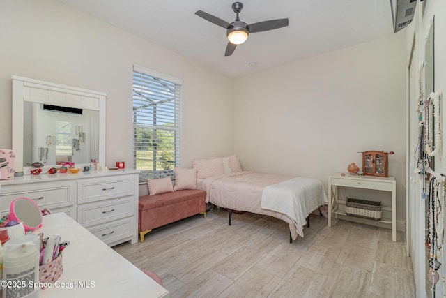 bedroom featuring ceiling fan and light hardwood / wood-style floors