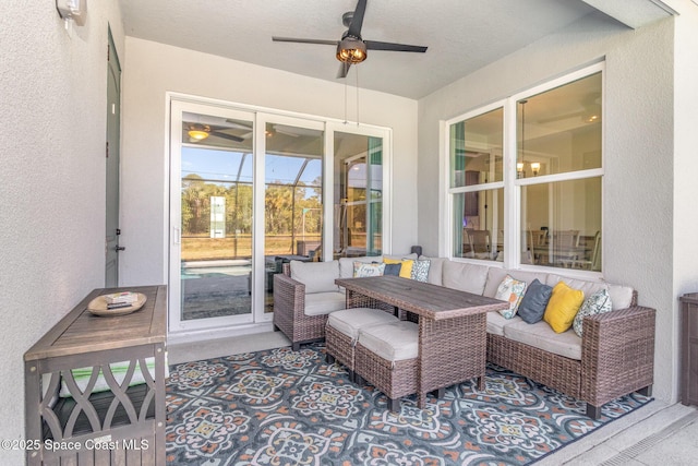 view of patio / terrace with an outdoor living space and ceiling fan