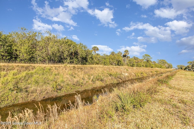 view of landscape with a water view