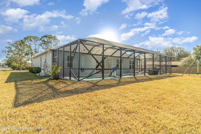 view of outbuilding with a swimming pool and a lawn