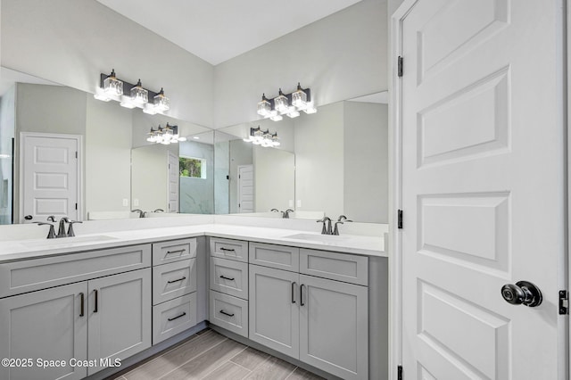 bathroom featuring vanity, hardwood / wood-style floors, and a shower