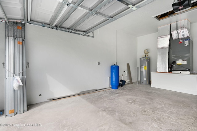 garage featuring a garage door opener and electric water heater