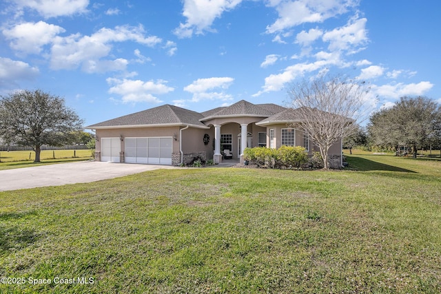 view of front of property with a garage and a front yard