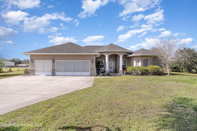 view of front facade with a garage and a front yard