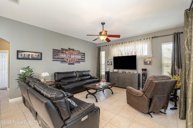 tiled living room featuring ceiling fan