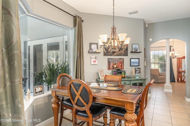 dining area featuring an inviting chandelier and light tile patterned flooring