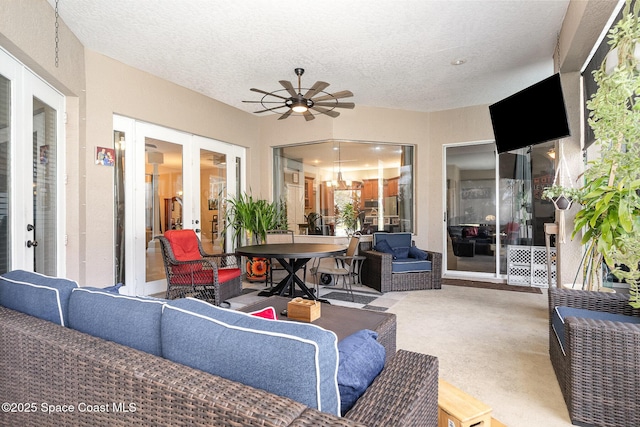 view of patio featuring an outdoor living space and ceiling fan