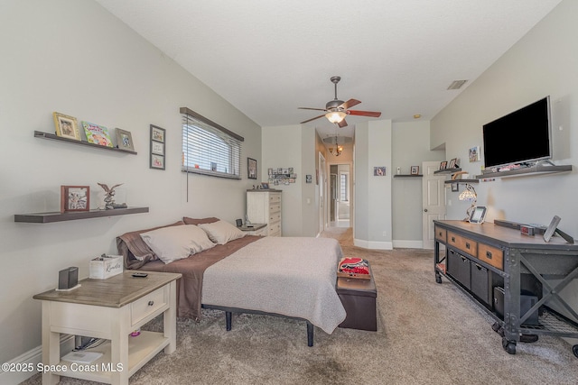 bedroom featuring ceiling fan, carpet flooring, and a textured ceiling