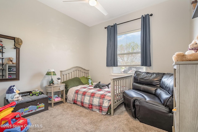 bedroom with lofted ceiling, carpet flooring, and ceiling fan