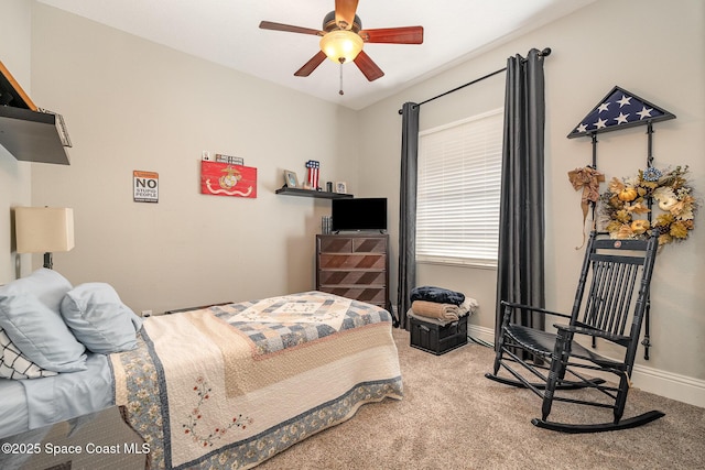 bedroom with light carpet and ceiling fan