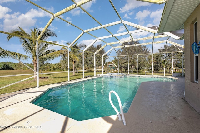 view of pool with a lanai, a patio area, and a lawn