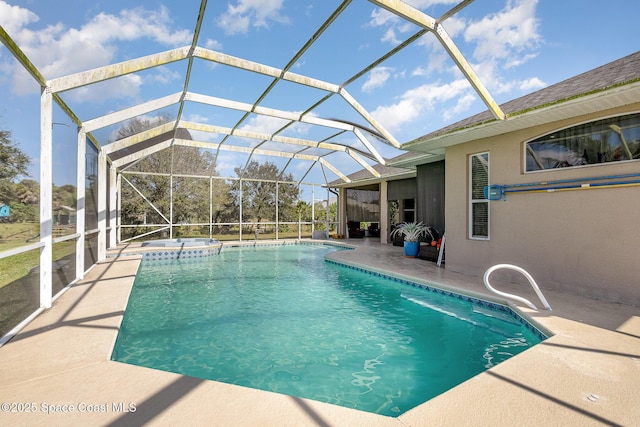 view of swimming pool with a lanai and a patio area