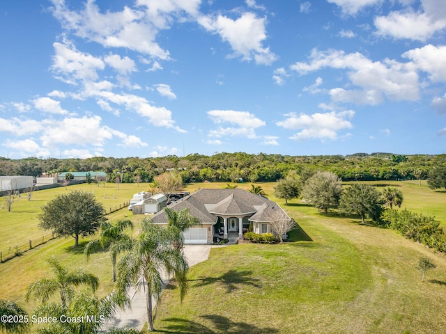 birds eye view of property featuring a rural view