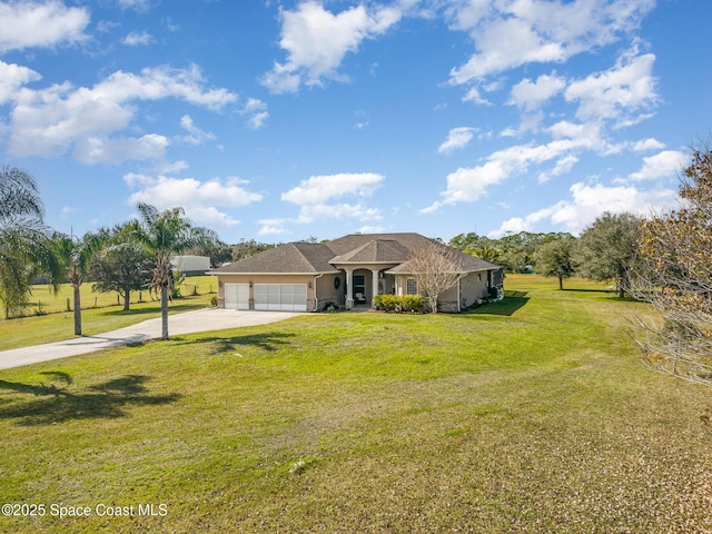 single story home featuring a garage and a front lawn