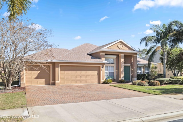 view of front of property with a garage