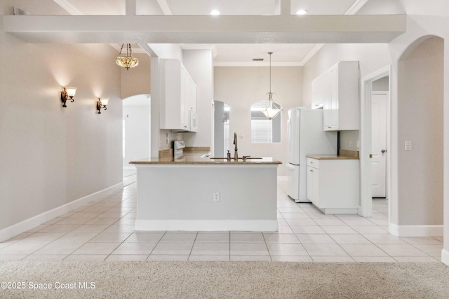 kitchen featuring sink, crown molding, pendant lighting, white appliances, and white cabinets