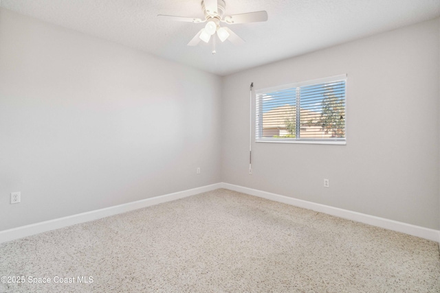 spare room featuring a textured ceiling and ceiling fan