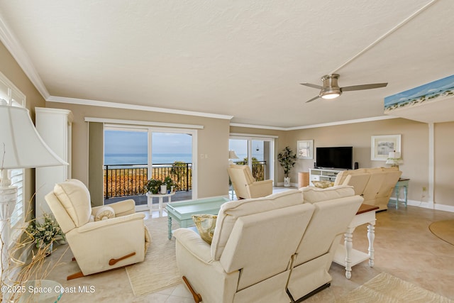 tiled living room featuring ornamental molding and ceiling fan