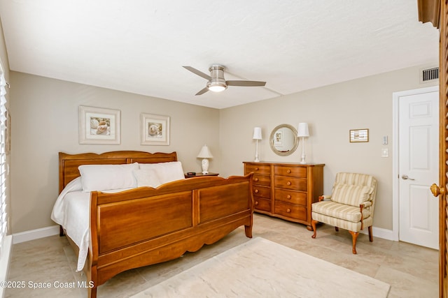 bedroom with baseboards, visible vents, and ceiling fan