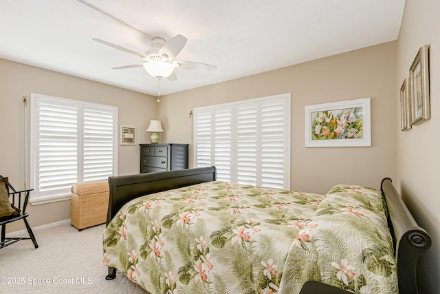 bedroom with light carpet and ceiling fan