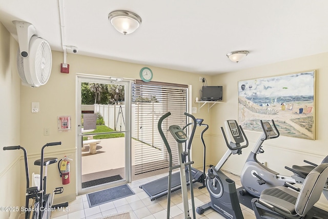 workout room featuring light tile patterned flooring