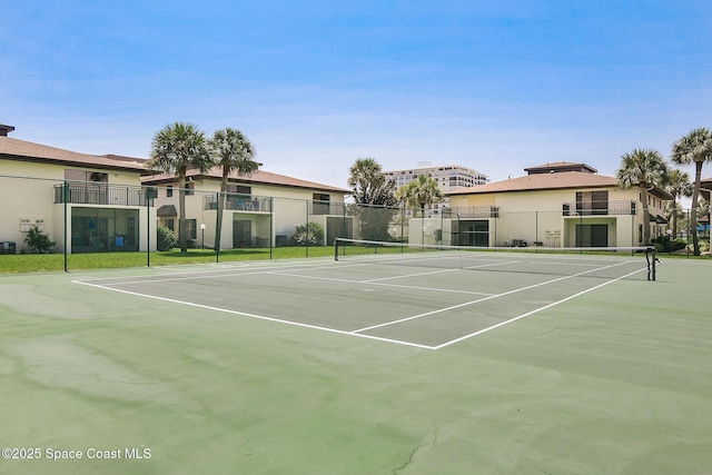 view of sport court with fence