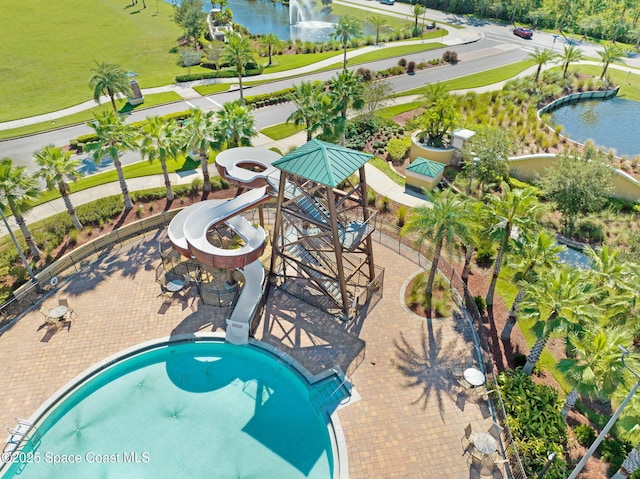 view of pool featuring a water view and a water slide