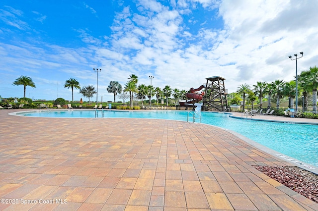 view of swimming pool with a patio