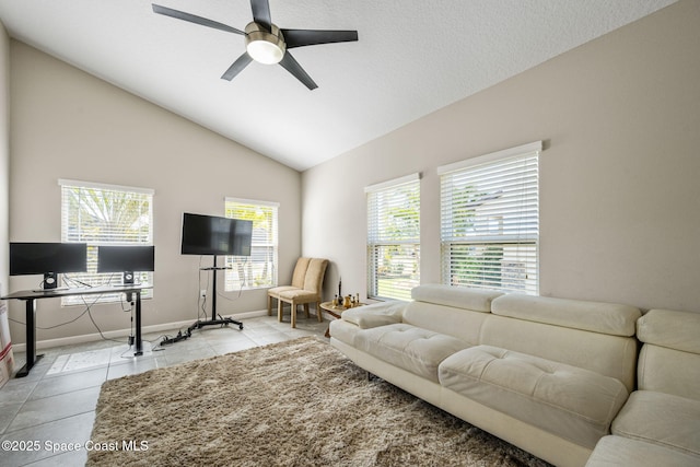 tiled living room with vaulted ceiling, a textured ceiling, and ceiling fan