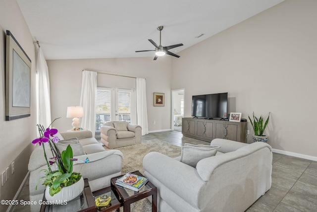 tiled living room featuring high vaulted ceiling and ceiling fan