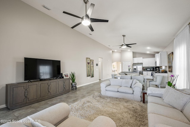 living room featuring high vaulted ceiling and ceiling fan