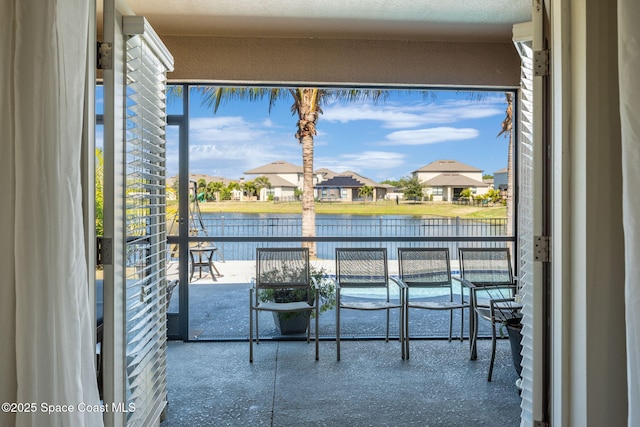 balcony featuring a water view