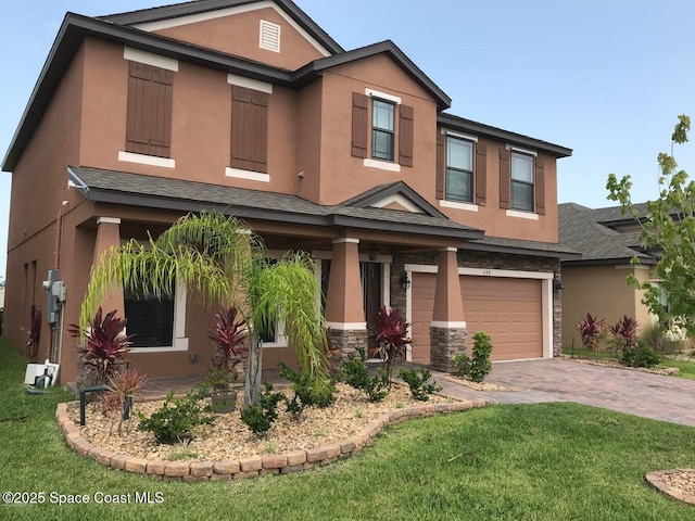 view of front of property with a garage and a front yard