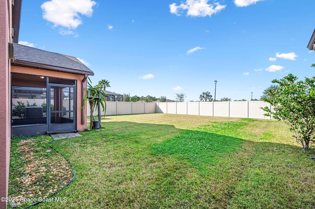 view of yard with a sunroom