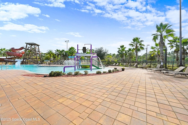 view of pool with a water slide