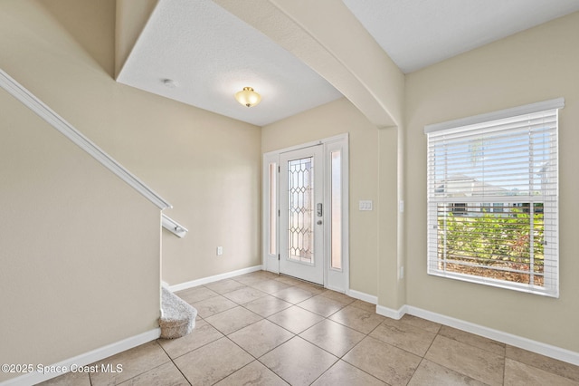 entryway featuring light tile patterned floors