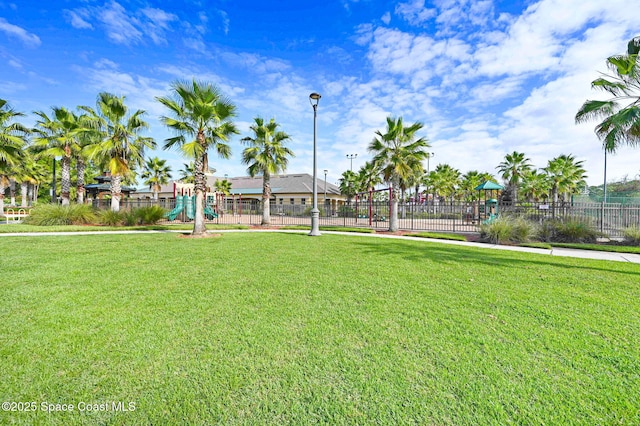 view of community featuring a lawn and a playground