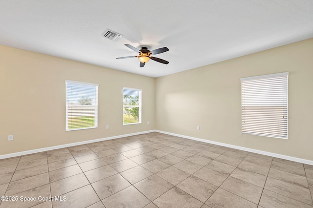 unfurnished room with ceiling fan