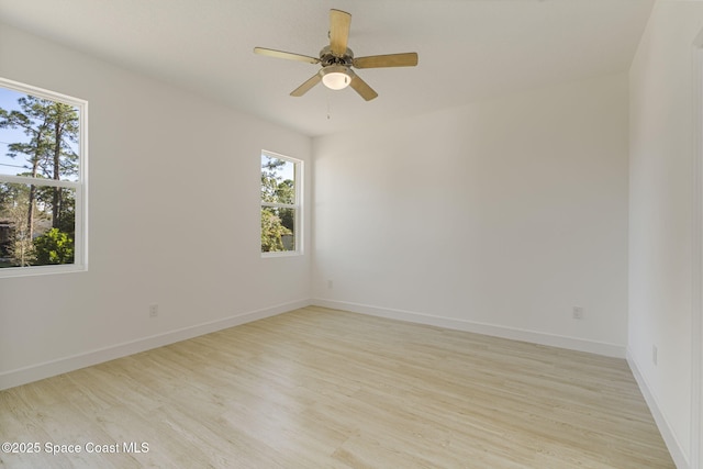 spare room featuring ceiling fan and light wood-type flooring