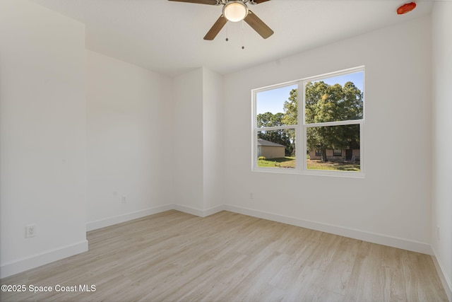 spare room featuring ceiling fan and light wood-type flooring