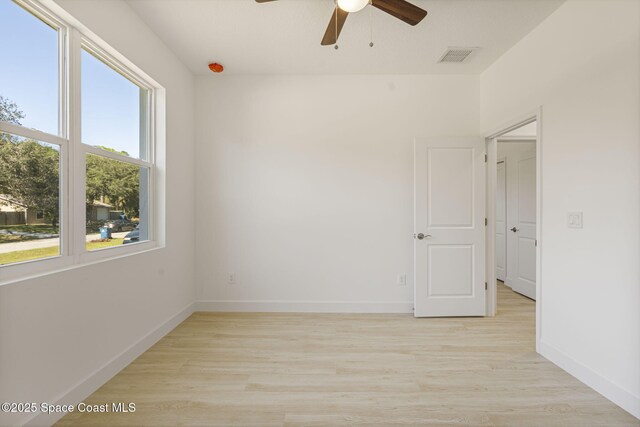 unfurnished room with ceiling fan and light hardwood / wood-style flooring