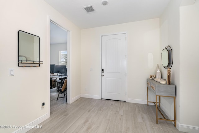 entryway with light hardwood / wood-style flooring