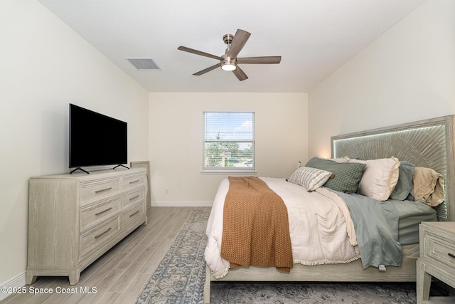 bedroom featuring light hardwood / wood-style flooring and ceiling fan