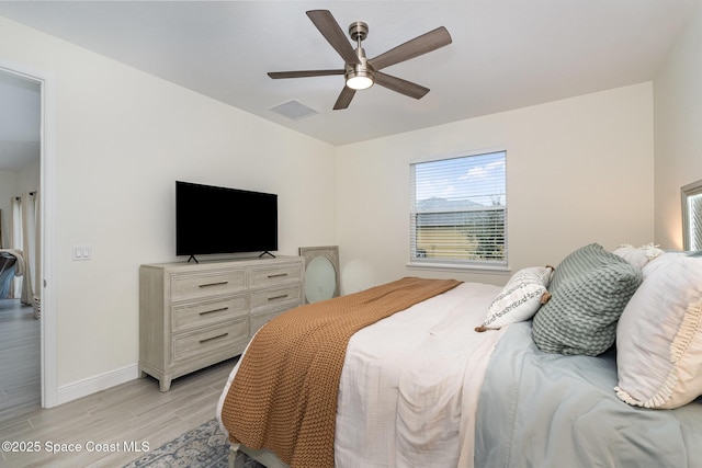 bedroom featuring light hardwood / wood-style flooring and ceiling fan