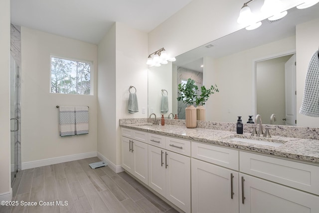 bathroom featuring wood-type flooring and vanity